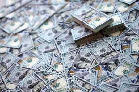Very big amount of US hundred dollar bills close up. Huge quantity of united states currency notes on flat tableの写真素材