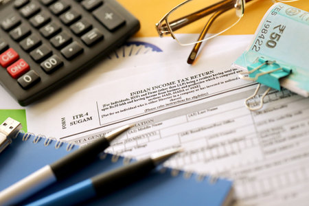 Indian income tax return blank form with pen and indian rupees bills on indian country flag close up. Annual tax report conceptの写真素材