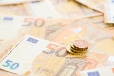 Very big amount of fifty european euro banknotes in huge pile close up