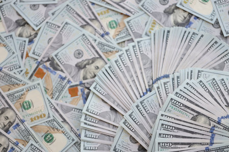 Very big amount of US hundred dollar bills close up. Huge quantity of united states currency notes on flat tableの写真素材