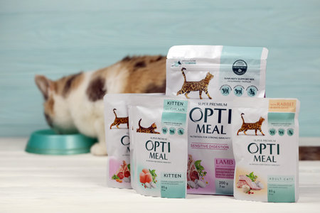KHARKIV, UKRAINE - JANUARY 2, 2021 Optimeal cat meal packs. Optimeal is product by Kormotech LLC, a global family company with Ukrainian roots, the largest producer of pet food in Ukraineのeditorial素材