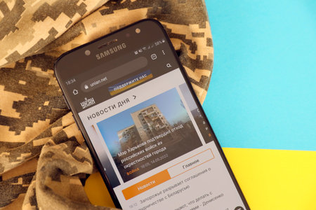 KYIV, UKRAINE - 4 MAY, 2023: Unian ukrainian news portal on smartphone screen with ukrainian flag...