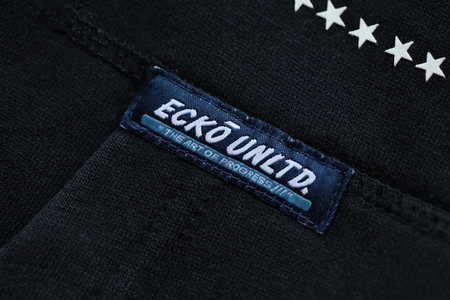 KYIV, UKRAINE - 4 MAY, 2023: Ecko Unltd company logo on new brand clothes close up