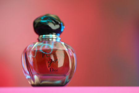 KYIV, UKRAINE - 4 MAY, 2023: Bottle of Poison Girl perfume by Dior, a French multinational luxury fashion house founded in 1946のeditorial素材