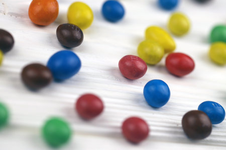 KHARKIV, UKRAINE - JANUARY 2, 2021 M and Ms colorful button shaped chocolate candies. Multi colored chocolates each of which has the letter m printed in lower case in white on one sideのeditorial素材
