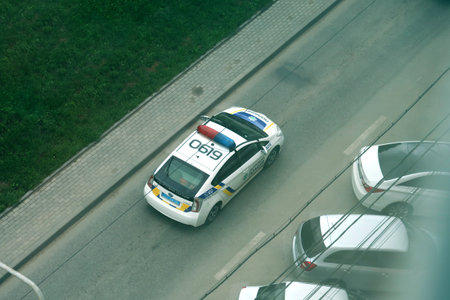 TERNOPIL, UKRAINE - JULY 7, 2023 Ukrainian patrol police white car with police lights and decals in daytime outdoorsのeditorial素材