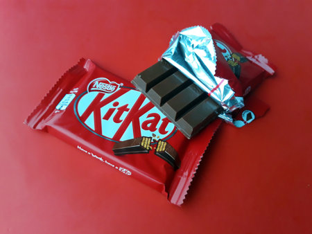 KHARKIV, UKRAINE - JANUARY 2, 2021 Kit Kat by Nestle chocolate covered wafer on bright color...