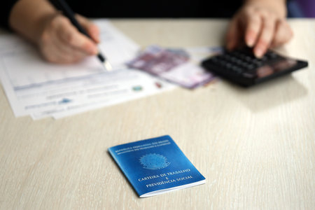Brazilian work card and social security blue book lies on accountant or boss table close upの写真素材