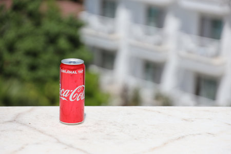ANTALYA, TURKEY - MAY 18, 2021 Can of Coca Cola on bar desk, close up. Coca Cola Company is the leading manufacturer of soda drinks in the worldのeditorial素材