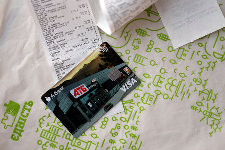 KYIV, UKRAINE - 4 MAY, 2023: ATB supermarket discount VISA card for low prices on different goods...