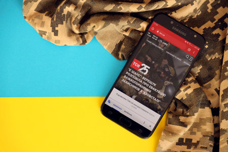 KYIV, UKRAINE - 4 MAY, 2023: TSN ukrainian news portal on smartphone screen with ukrainian flag and...