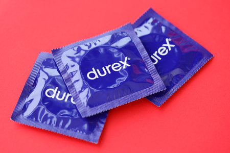 KYIV, UKRAINE - NOVEMBER 27, 2023 Durex blue condoms pack with logo close up