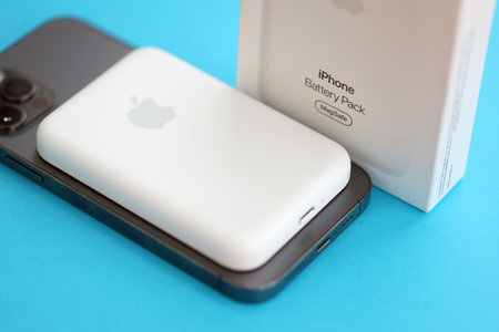 KYIV, UKRAINE - OCTOBER 31, 2023 Apple MagSafe battery device for iPhone charging via magnet...