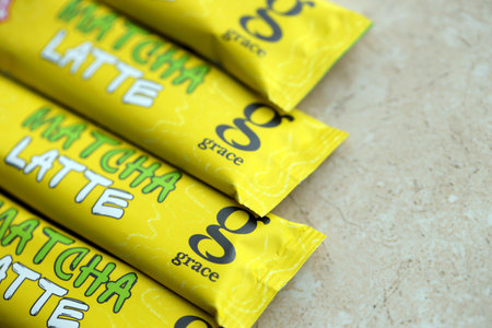 KYIV, UKRAINE - OCTOBER 31, 2023 Matcha Latte yellow sticks of green matcha drink produced by Grace...