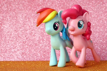 TERNOPIL, UKRAINE - JULY 7, 2023 Old toy with character from My Little Pony MLP cartoon TV show on bright shiny glitter background close upのeditorial素材