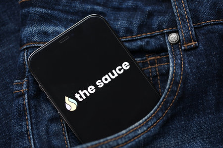 KYIV, UKRAINE - FEBRUARY 23, 2024 The Sauce logo of famous dating website or app on iPhone display screen close upのeditorial素材