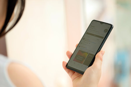 KYIV, UKRAINE - JULY 7, 2023 Threads by Meta application on display of Samsung smartphone in young female handのeditorial素材