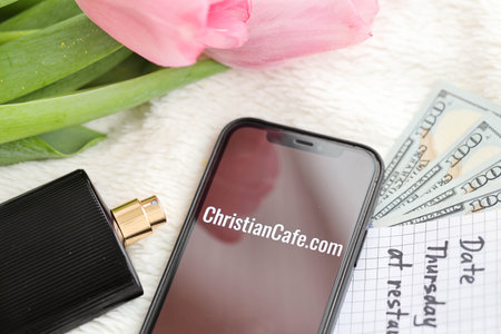 KYIV, UKRAINE - FEBRUARY 23, 2024 ChristianCafe logo of famous dating website or app on iPhone display screen close upのeditorial素材