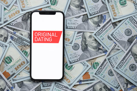 KYIV, UKRAINE - FEBRUARY 23, 2024 Original Dating logo of famous dating website or app on iPhone display screen close upのeditorial素材