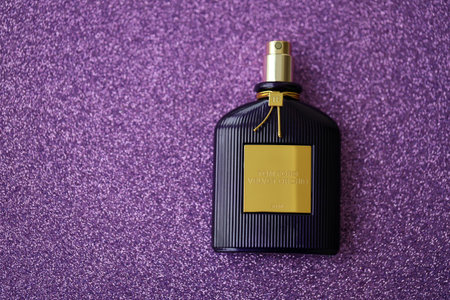 KYIV, UKRAINE - NOVEMBER 27, 2023 Tom Ford velvet orchid fragrance perfume bottle lies on light lilac background. Tom Ford is American fashion designer launched his eponymous luxury brand in 2006のeditorial素材
