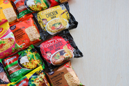 KYIV, UKRAINE - OCTOBER 31, 2023 Many packs of instant noodles for fast cooking by various brands and manufacturers close upのeditorial素材