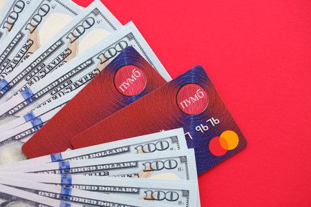 TERNOPIL, UKRAINE - JULY 7, 2023 Bank Card of PUMB Ukrainian Bank FUIB with red logo close upのeditorial素材