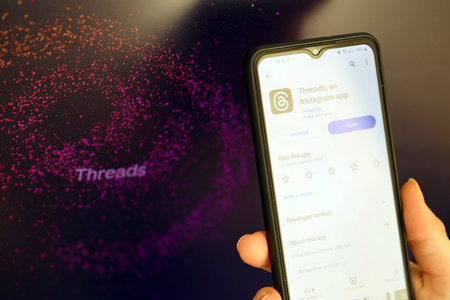 KYIV, UKRAINE - JULY 7, 2023 Threads by Meta application on display of Samsung smartphone in young female handのeditorial素材