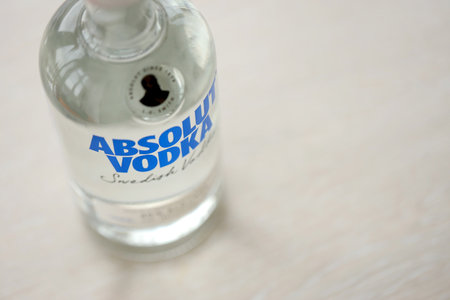 KYIV, UKRAINE - NOVEMBER 27, 2023 Absolut Vodka bottle produced near Ahus, Sweden. Owned by French group Pernod Ricard it is one of the largest brand of alcoholic spiritsのeditorial素材