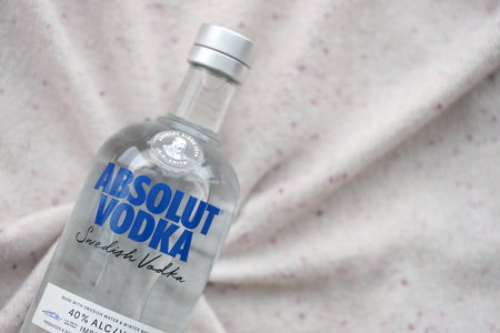 KYIV, UKRAINE - NOVEMBER 27, 2023 Absolut Vodka bottle produced near Ahus, Sweden. Owned by French group Pernod Ricard it is one of the largest brand of alcoholic spiritsのeditorial素材