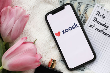 KYIV, UKRAINE - FEBRUARY 23, 2024 Zoosk logo of famous dating website or app on iPhone display...