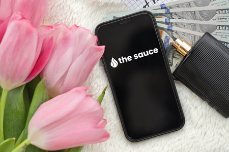 KYIV, UKRAINE - FEBRUARY 23, 2024 The Sauce logo of famous dating website or app on iPhone display screen close upのeditorial素材