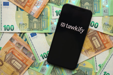 KYIV, UKRAINE - FEBRUARY 23, 2024 Tawkify logo of famous dating website or app on iPhone display...