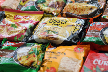 KYIV, UKRAINE - OCTOBER 31, 2023 Many packs of instant noodles for fast cooking by various brands and manufacturers close upのeditorial素材