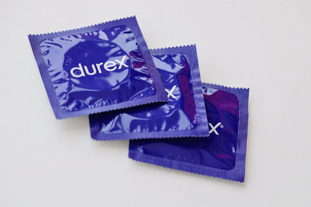 KYIV, UKRAINE - NOVEMBER 27, 2023 Durex blue condoms pack with logo close up