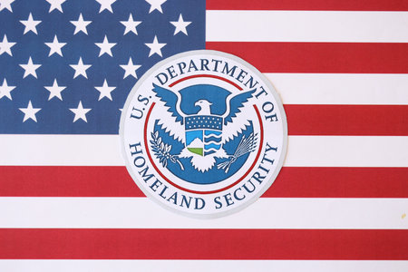 KYIV, UKRAINE - MARCH 9, 2024 US Department of Homeland Security seal on United States of America flag close upのeditorial素材