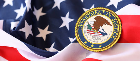 KYIV, UKRAINE - MARCH 9, 2024 US Department of Justice seal on United States of America flag close upのeditorial素材