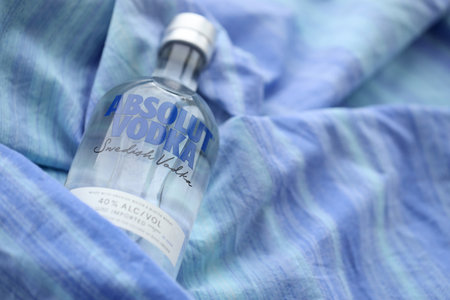 KYIV, UKRAINE - NOVEMBER 27, 2023 Absolut Vodka bottle produced near Ahus, Sweden. Owned by French group Pernod Ricard it is one of the largest brand of alcoholic spiritsのeditorial素材