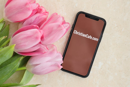 KYIV, UKRAINE - FEBRUARY 23, 2024 ChristianCafe logo of famous dating website or app on iPhone display screen close upのeditorial素材