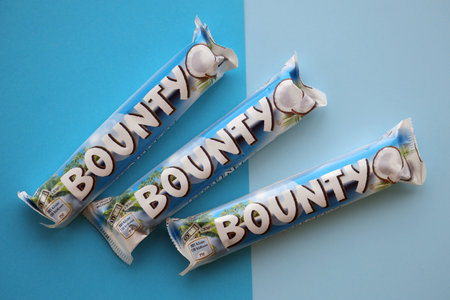 KYIV, UKRAINE - OCTOBER 31, 2023 Bounty chocolate bars with cocoa flavor filling. Bounty chocolate bar is a brand of American Mars Inc companyのeditorial素材