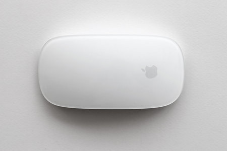 KYIV, UKRAINE - NOVEMBER 27, 2023 Apple Magic Mouse 3rd generation lies on white background close upのeditorial素材