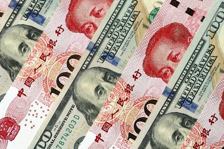 Many money bills of People Republic of China and United States. PRC Yuan and USD dollars banknotes close upの写真素材
