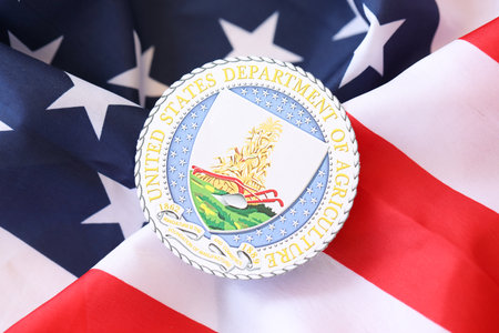 KYIV, UKRAINE - MARCH 9, 2024 US Department of Agriculture seal on United States of America flag close upのeditorial素材