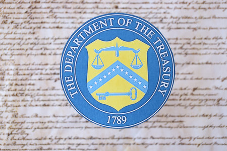 KYIV, UKRAINE - MARCH 9, 2024 US The Department of the Treasury seal on United States Constitution...