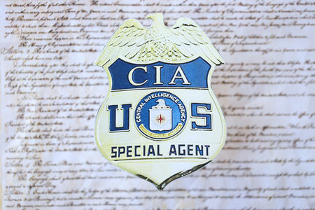 KYIV, UKRAINE - MARCH 9, 2024 US CIA Central Intelligence Agency badge on United States Constitution...