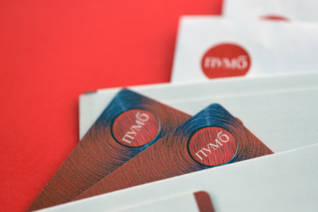 TERNOPIL, UKRAINE - JULY 7, 2023 Bank Card of PUMB Ukrainian Bank FUIB with red logo close upのeditorial素材