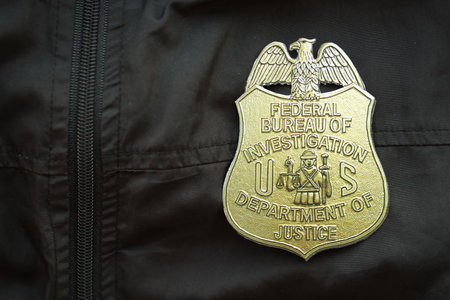 KYIV, UKRAINE - MARCH 9, 2024 US FBI Federal Bureau of Investigation badge on black jacket uniform...