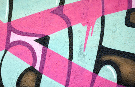 Colorful background of graffiti painting artwork with bright aerosol outlines on wall. Old school street art piece made with aerosol spray paint cans. Contemporary youth culture backdropの写真素材