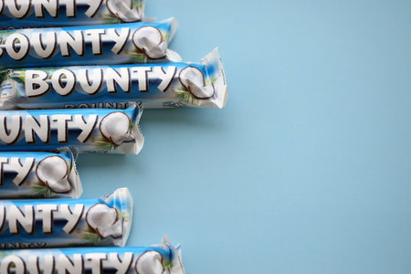 KYIV, UKRAINE - OCTOBER 31, 2023 Bounty chocolate bars with cocoa flavor filling. Bounty chocolate...
