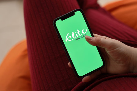 KYIV, UKRAINE - FEBRUARY 23, 2024 Elite Singles logo of famous dating website or app on iPhone...