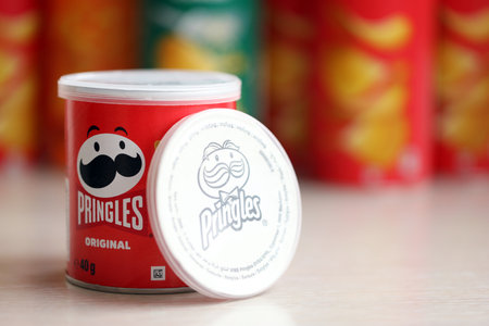 KYIV, UKRAINE - FEBRUARY 27, 2024 Pringles original potato chips on white background. Pringles is a brand of potato snack chips owned by the Kellogg Companyのeditorial素材